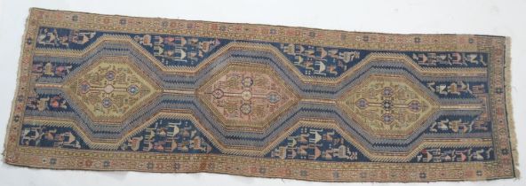 Unusual flatweave runner, possibly Shirvan, centred with three pole medallions against a blue