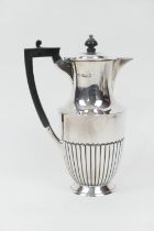 George V silver hot water jug, maker H A, Sheffield 1910, half reeded form with ebony finial and