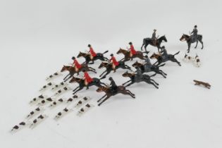 Britains fox hunting set, comprising eleven figures on horseback, sixteen hounds and a fox (Please