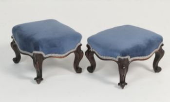 Pair of early Victorian rosewood footstools, circa 1845, with blue fabric upholstered pad seats,