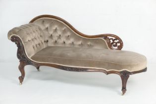 Victorian rosewood and upholstered chaise longue, having a serpentine shaped back carved with