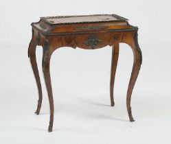 French burr walnut and ormolu jardiniere table, having a lift up cover with foliate ormolu mounts to