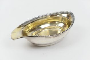 George III silver pap boat, maker SH, London 1814, with beaded edge and gilt interior, 12.5cm,