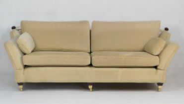 Multiyork knole settee, upholstered throughout in pale gold fabric, with brass castors, width 250cm,