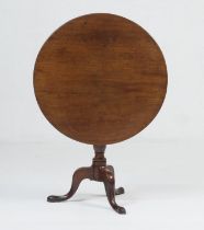 Mahogany tilt top tripod table, late 18th Century, circular folding top over a turned urn column and