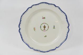 Leeds creamware platter, circa 1790, the centre decorated with an urn and with floral sprigs, within