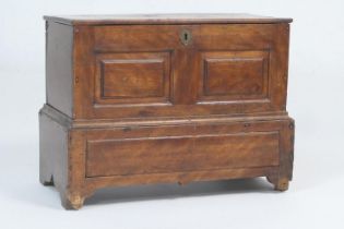 Fruitwood cofferbach, late 18th Century, with lift up lid, two fielded panel front, the base