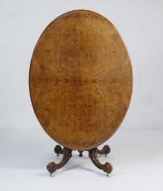 Victorian burr walnut tilt top breakfast table, the oval top with quarter burr veneers over a turned