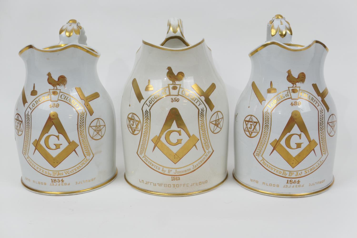 Freemasonry interest: three stoneware jugs, each inscribed in gilt 'Lodge of Charity', with two