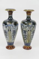 Pair of Doulton Lambeth stoneware vases, ovoid form with trumpet neck, relief moulded with wild