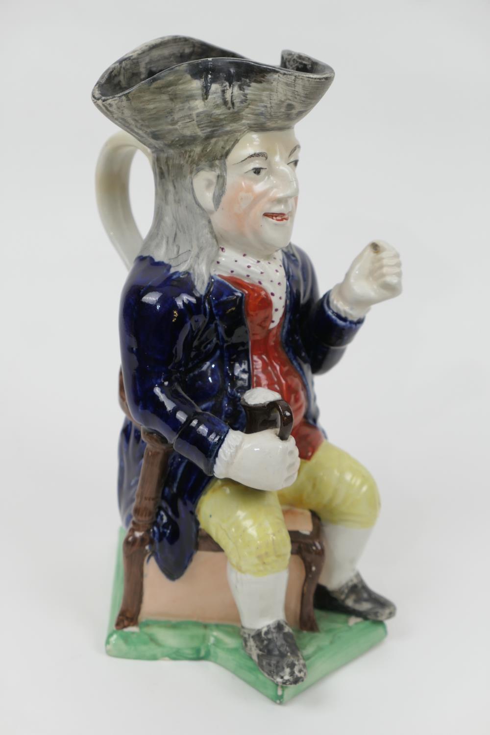 Victorian thin man toby jug, decorated in underglaze blue and overglaze colours (restored), height