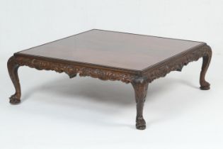 Large mahogany square coffee table, with nicely figured veneers, crossbanded and with carved apron