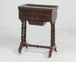 French walnut sewing table, mid 19th Century, the lift up top with moulded edge opening to a