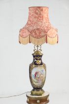 Sevres style hand decorated porcelain vase lamp, with brass mounts and decorated with gilded