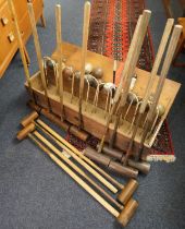 George Bussey & Co., London, croquet set, comprising four named mallets, thirteen worn coloured