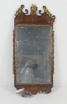 George III walnut and parcel gilt mirror, the plate 72cm x 42cm, the frame extensively damaged and