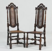 Pair of walnut high back side chairs, late 17th Century with later restorations, arched and scrolled