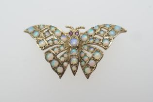 9ct gold and opal butterfly brooch, with ruby eyes, set with cabochon stones throughout, fully