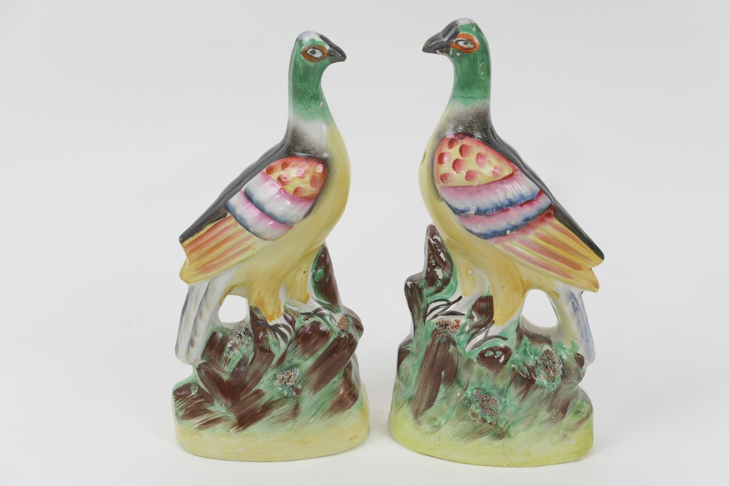 Pair of Victorian Staffordshire flatback pigeon ornaments, decorated throughout in colours (not