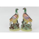 Pair of Victorian Staffordshire flatback pigeon ornaments, decorated throughout in colours (not