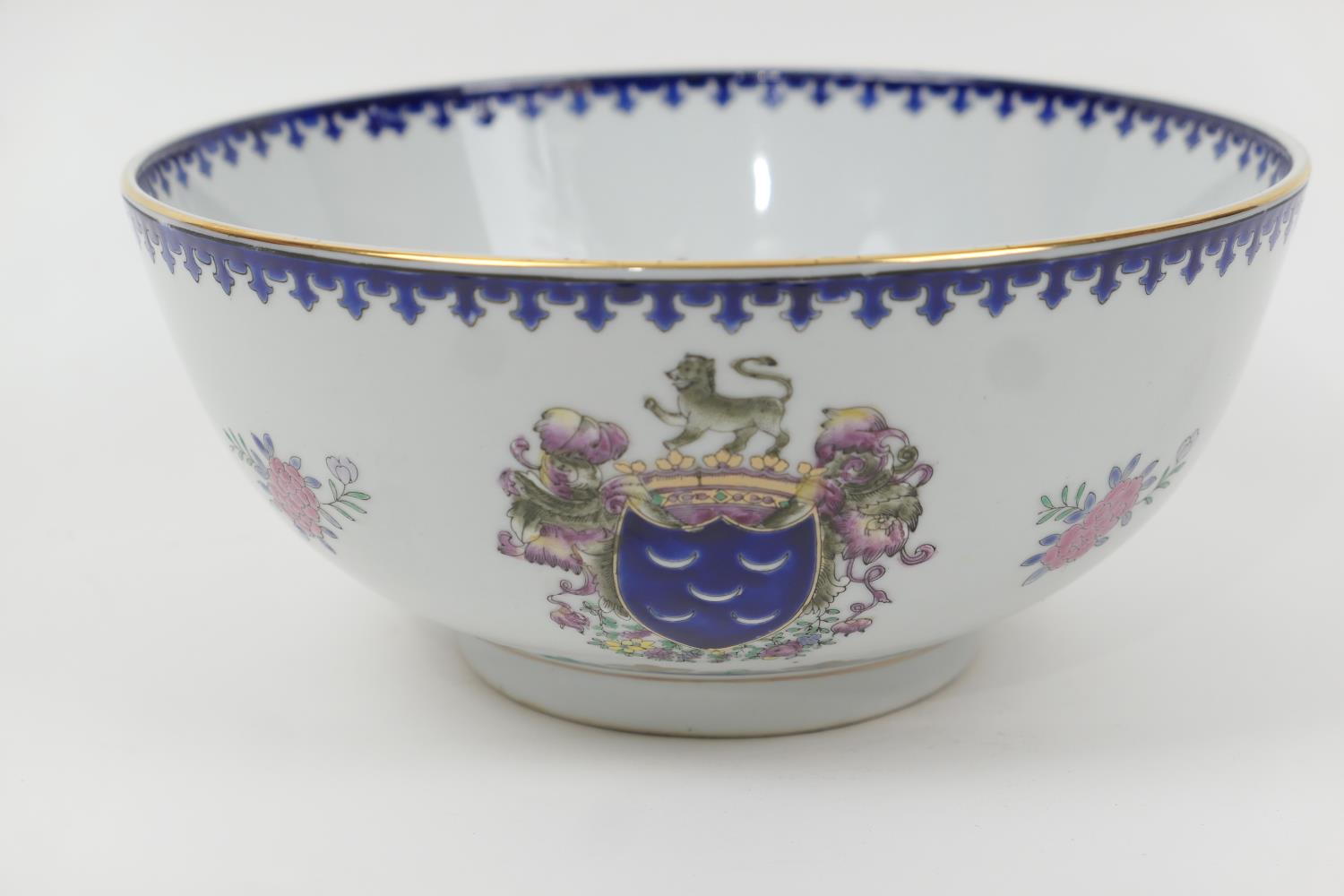 Porcelain bowl, in the Chinese style, decorated with arms and floral sprays in famille rose colours,