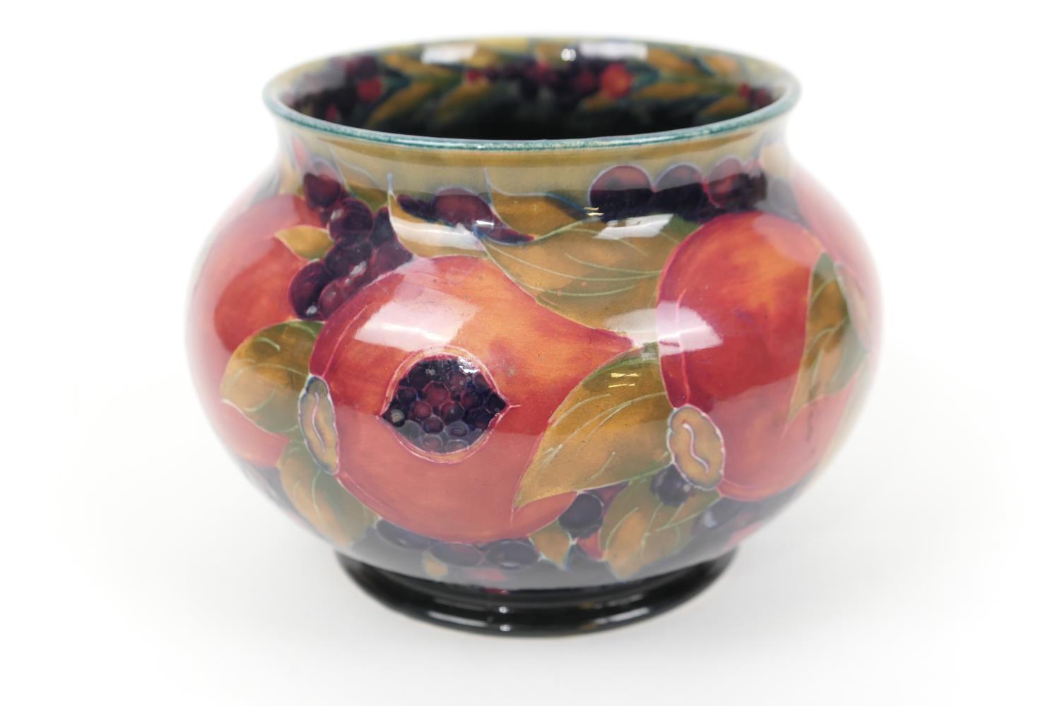 William Moorcroft pomegranate jardiniere, squat baluster form with a wide neck, deep blue ground,