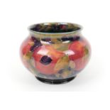 William Moorcroft pomegranate jardiniere, squat baluster form with a wide neck, deep blue ground,