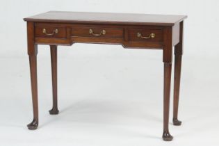 Mahogany side table in the Georgian style, rectangular top fitted with three small drawers, on