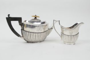 Late Victorian silver teapot, Sheffield 1894, Regency style of half reeded oval form with an ivory