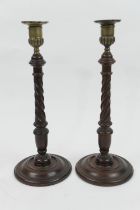 Pair of George III mahogany and brass candlesticks, circa 1780, with brass urn shaped sconce, over a