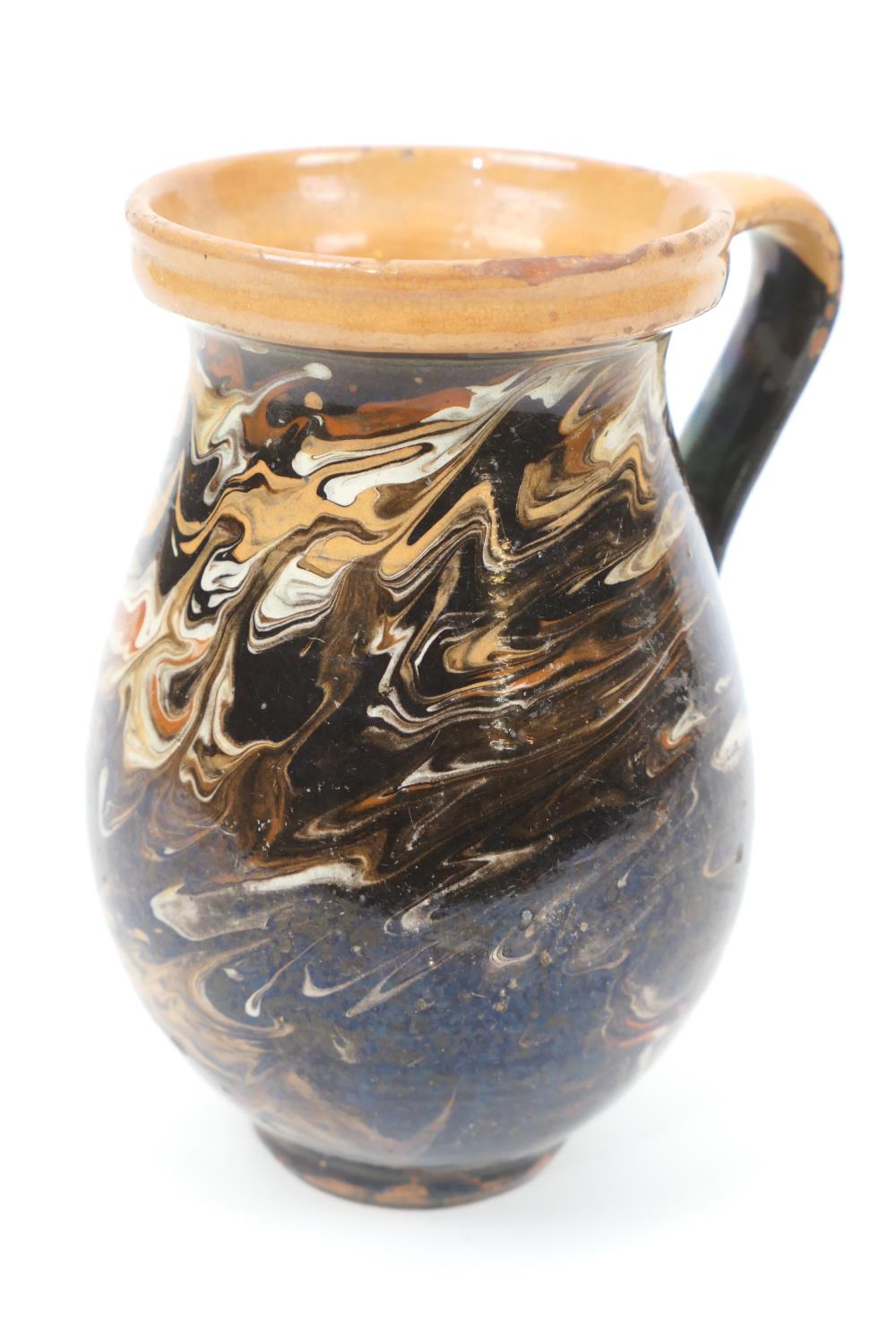 Victorian agate slip decorated earthenware jug, height 18cm (Please note condition is not noted.