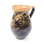 Victorian agate slip decorated earthenware jug, height 18cm (Please note condition is not noted.