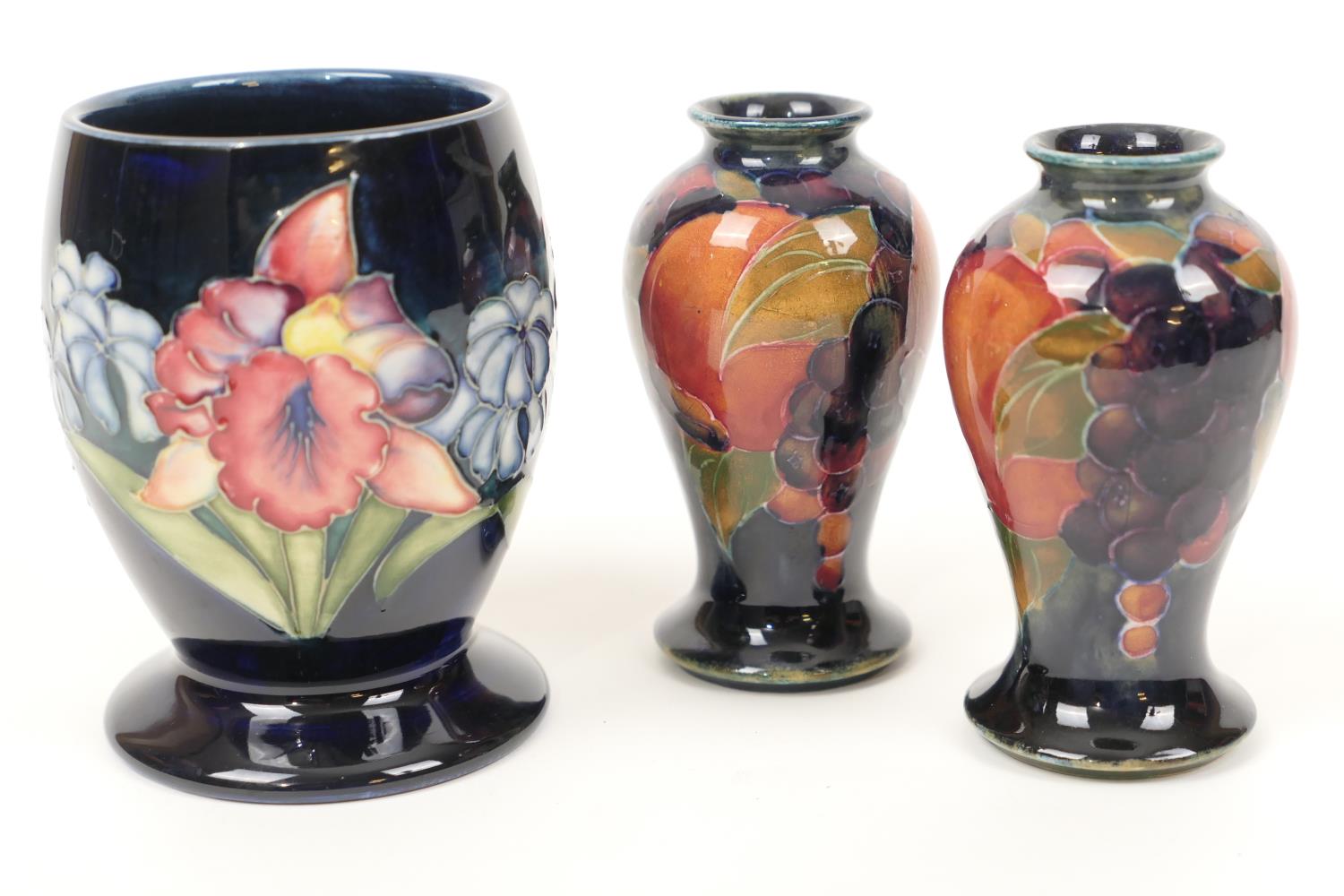 Pair of Moorcroft pomegranate small vases, inverted baluster form, impressed 'Burslem' mark and