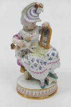 Meissen porcelain figure, late 19th Century, modelled as a girl seated with a pet dog and a