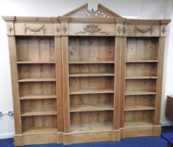 Pine breakfront open bookcase, in the Adam style, in three sections with adjustable shelves, width