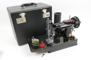 Singer 221K sewing machine, cased and with accessories (Please note condition is not noted. We