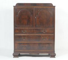 Mahogany tallboy cabinet, in the Chippendale Revival style, circa 1910, having two arched moulded