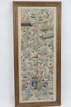 Two Chinese embroidered sleeve panels, framed as one, featuring figures within a garden in