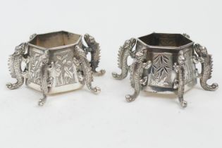 Pair of Chinese silver salts, late 19th Century, each of hexagonal form with applied dragon