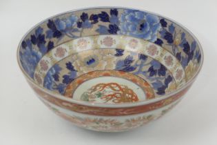 Japanese Fukugawa porcelain punch bowl, decorated throughout in Imari palette with underglaze