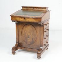 Victorian burr walnut and inlaid davenport, the top with tooled green leather writing slope and lift