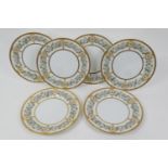 Six Haviland Limoges gilded dessert plates, the borders decorated with roses in pinks and tooled