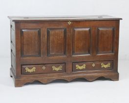 George III oak mule chest, circa 1760, the re-hinged double plank top over a four fielded panel