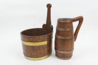 Oak and brass coopered piggin, 23cm diameter; also a copper banded oak jug, height 26cm (2) (