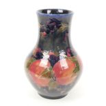 William Moorcroft pomegranate vase, baluster form with a wide neck, deep blue ground, impressed