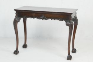 Mahogany side table in the Chippendale style, circa 1900, the rectangular top over a frieze with