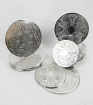 Quantity of modern silver plated circular table mats, comprising a set of nine 22.5cm diameter, a