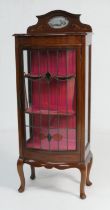 Edwardian mahogany and inlaid bow front display cabinet, circa 1905, the top with a small bevelled