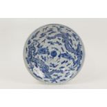 Chinese blue and white plate, early 20th Century, decorated with dragons chasing a central flaming