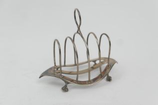 Late Victorian silver toast rack, by William Hutton & Sons, London 1899, four divisions, raised on